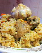 Плов из утки в казане на плите