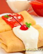 Блины с творогом, вишней, клубничным и ванильным соусом