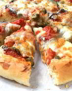 Пицца с ветчиной и шампиньонами